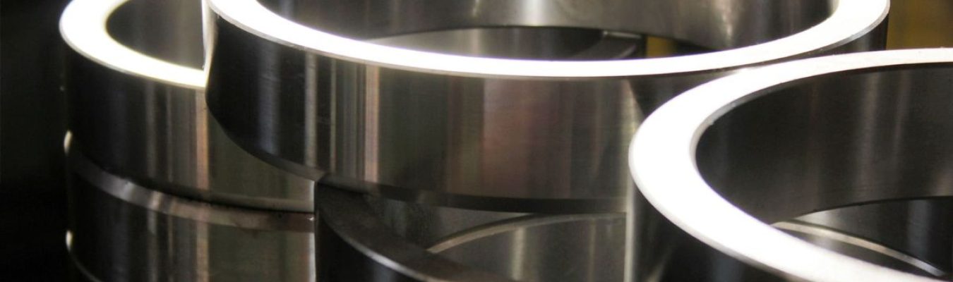 Close-up view of polished steel chrome bearing rings stacked for industrial use